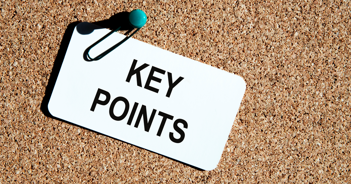 Inscription "Key Points" written on a white card and fixed to a brown cock board.